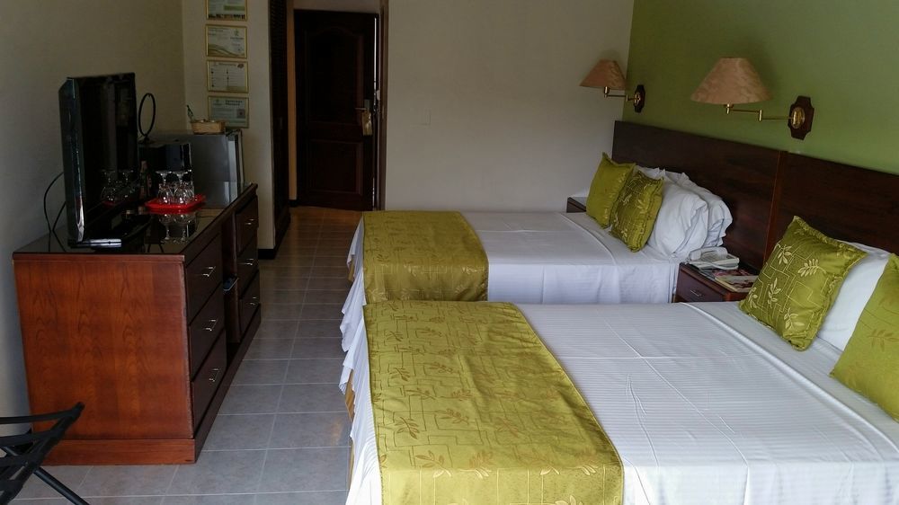 Casa Morales Hotel Internacional Y Centro De Convenciones Ibagué Екстериор снимка A room at the hotel